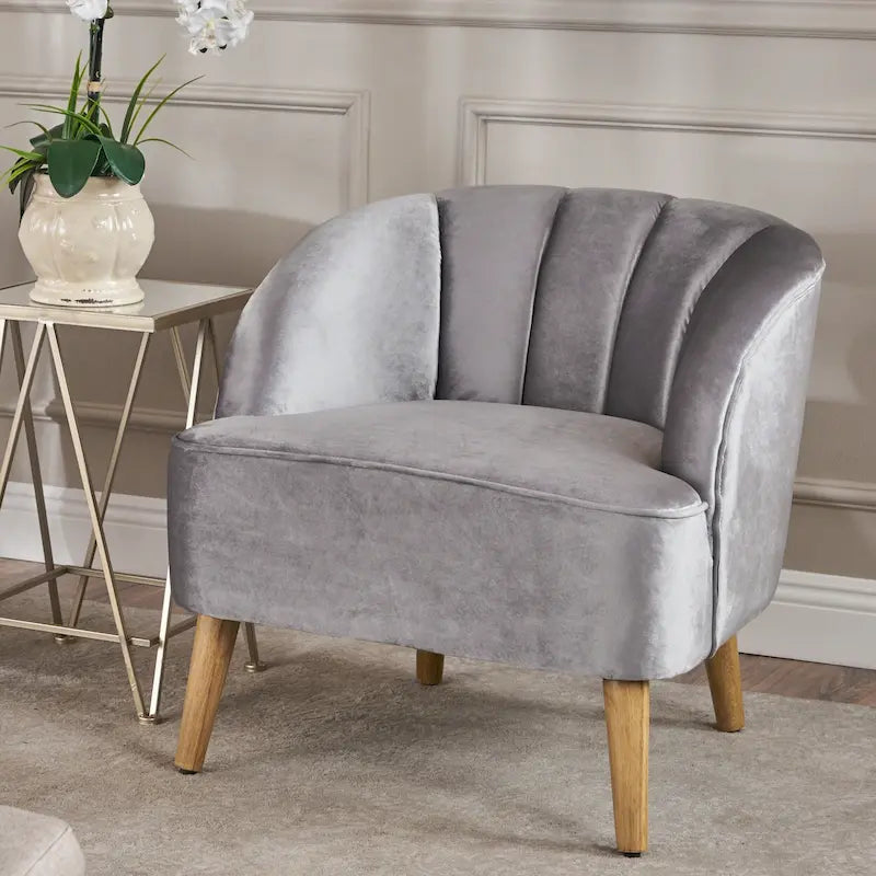 Fauteuil club moderne en velours avec pieds en bois de noyer