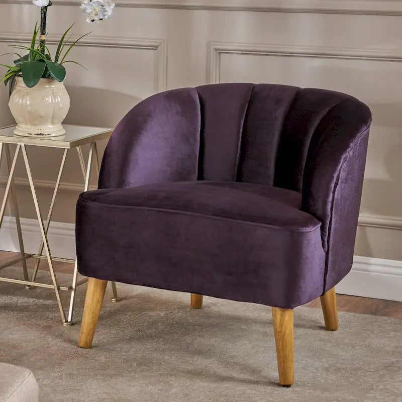 Fauteuil club moderne en velours avec pieds en bois de noyer