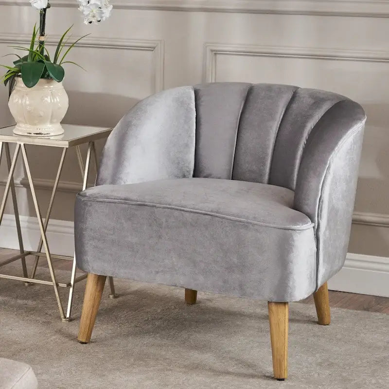 Fauteuil club moderne en velours avec pieds en bois de noyer