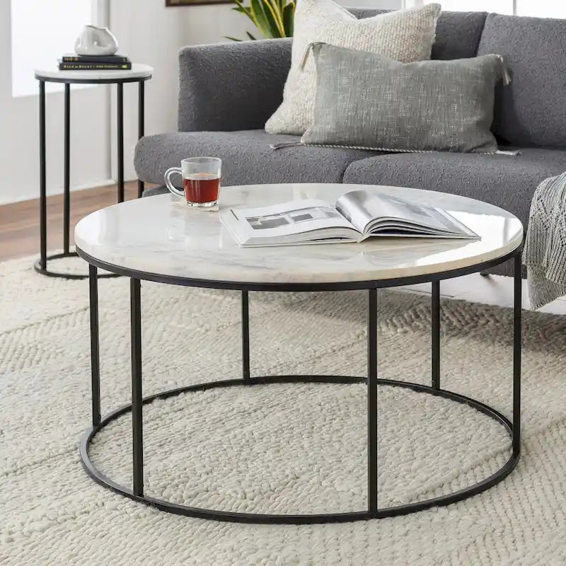 Table basse ronde en matériaux mixtes avec piètement en métal noir, plateau en bois marron