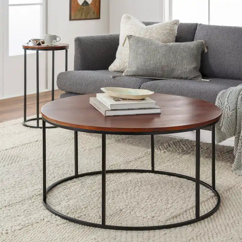 Table basse ronde en matériaux mixtes avec piètement en métal noir, plateau en bois marron