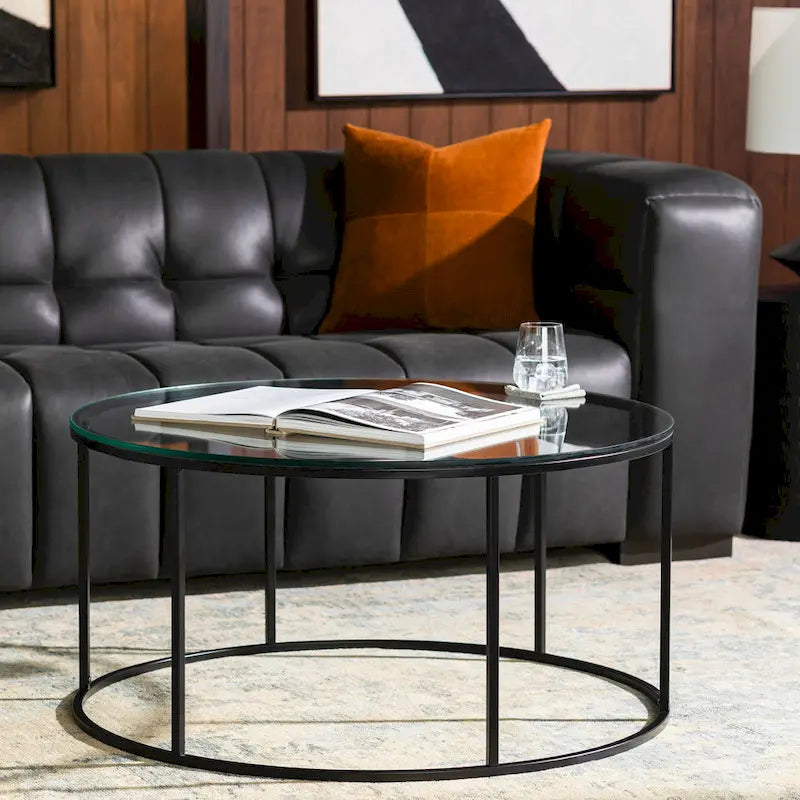 Table basse ronde en matériaux mixtes avec piètement en métal noir, plateau en bois marron